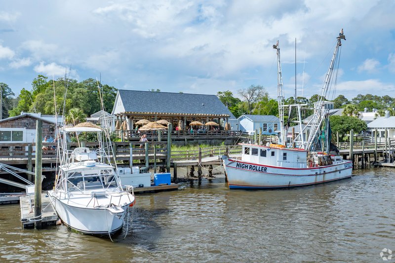Waterfront restaurant and fishing boats docked along the Intracoastal Waterway in Calabash, NC