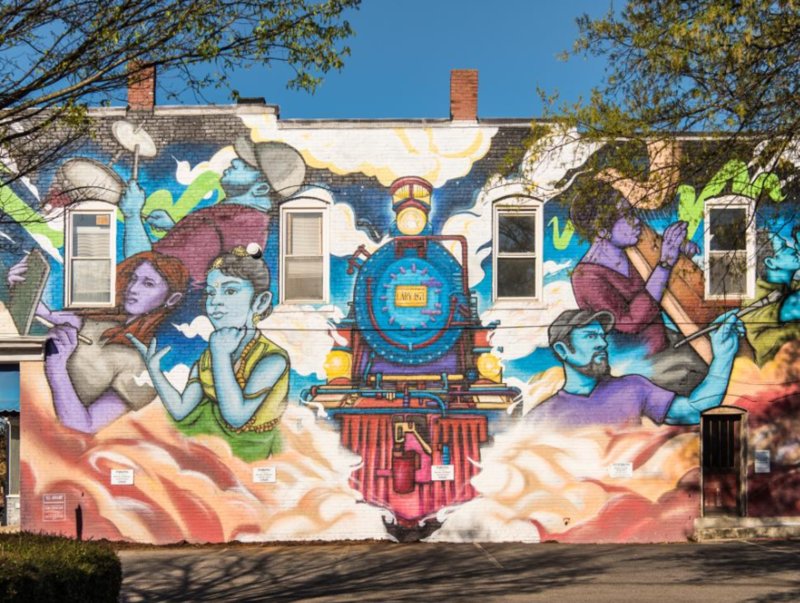 Colorful downtown mural featuring train in Cary, North Carolina.