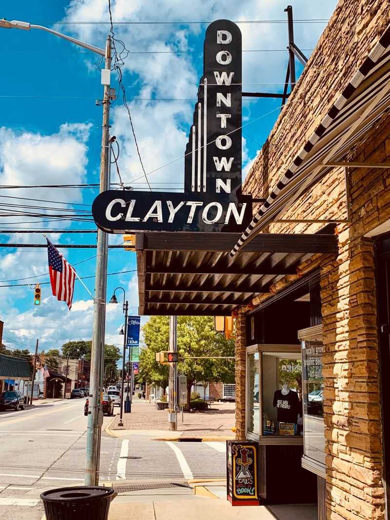 Downtown Clayton NC streetscape with historic storefronts and Clayton Theater sign