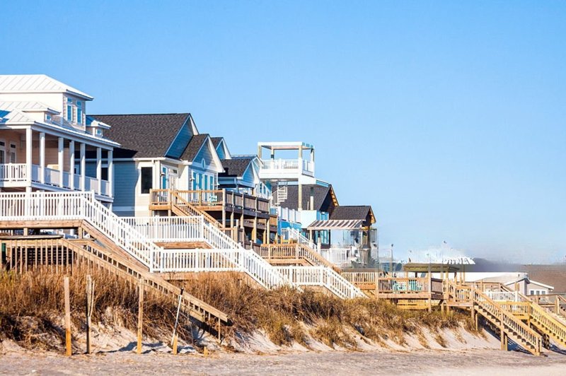 Beachfront homes elevated on dunes overlooking the ocean in Surf City near Hampstead, NC