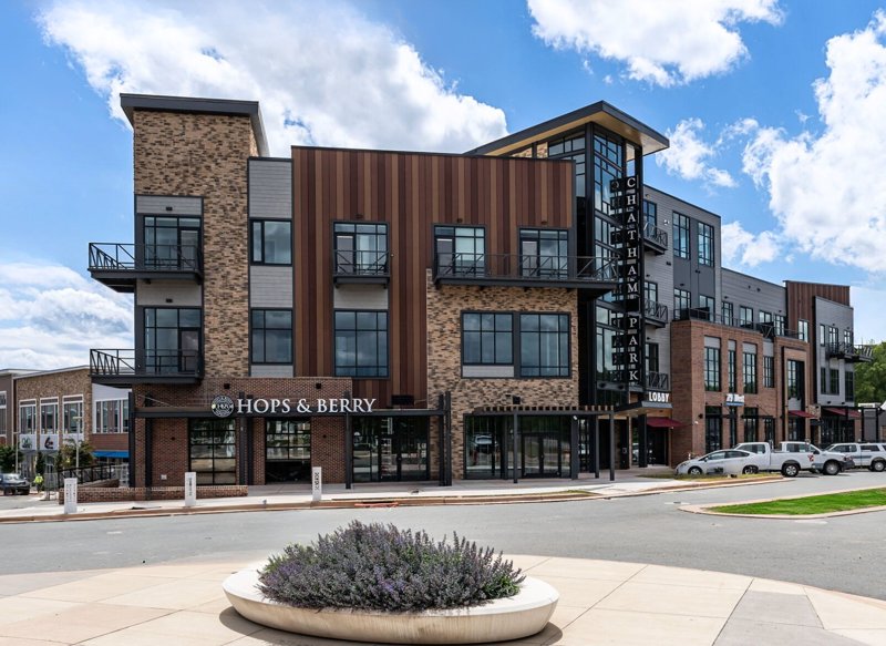 Exterior of Hops & Berry at Mosaic in Pittsboro, North Carolina with modern mixed-use buildings