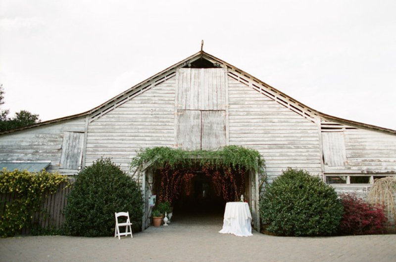Rustic barn at Fearrington Village in Pittsboro, North Carolina with greenery and event setting