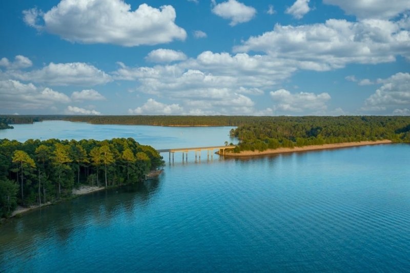 Aerial view of Jordan Lake near Pittsboro, North Carolina with bridge and surrounding forest