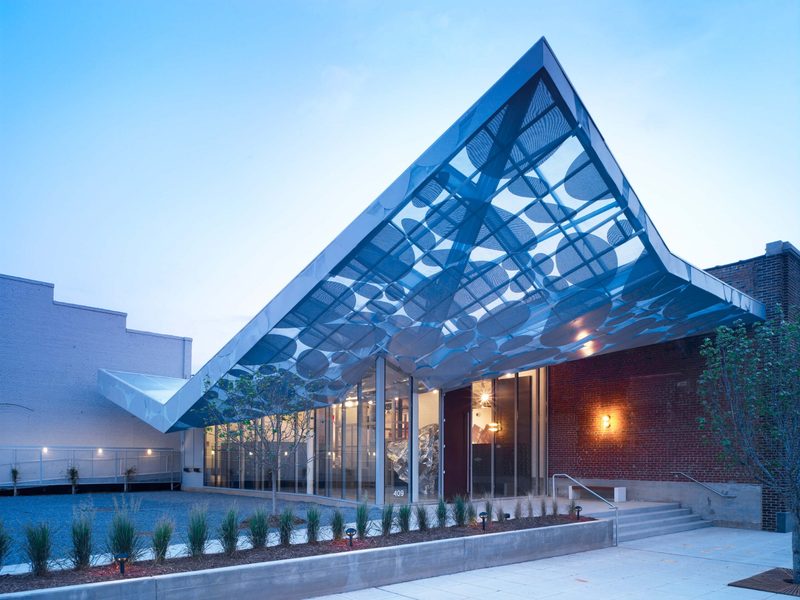 Contemporary Art Museum exterior with a modern blue canopy design in Raleigh, North Carolina.