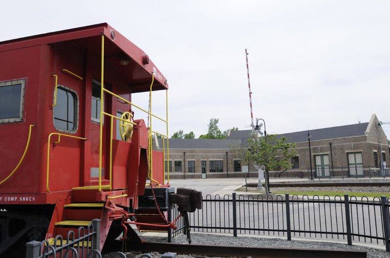 Historic train depot area with rail crossing and buildings in Selma, North Carolina.