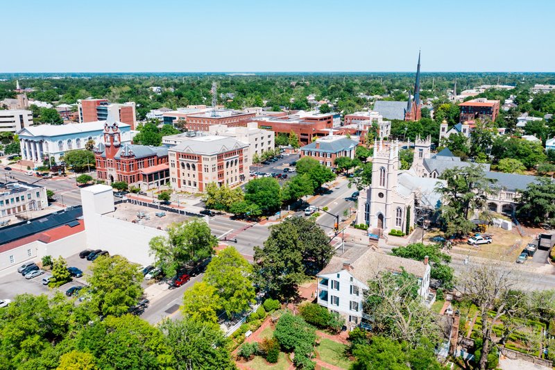Aerial view of downtown Wilmington with historic buildings and church steeples in Wilmington, NC.