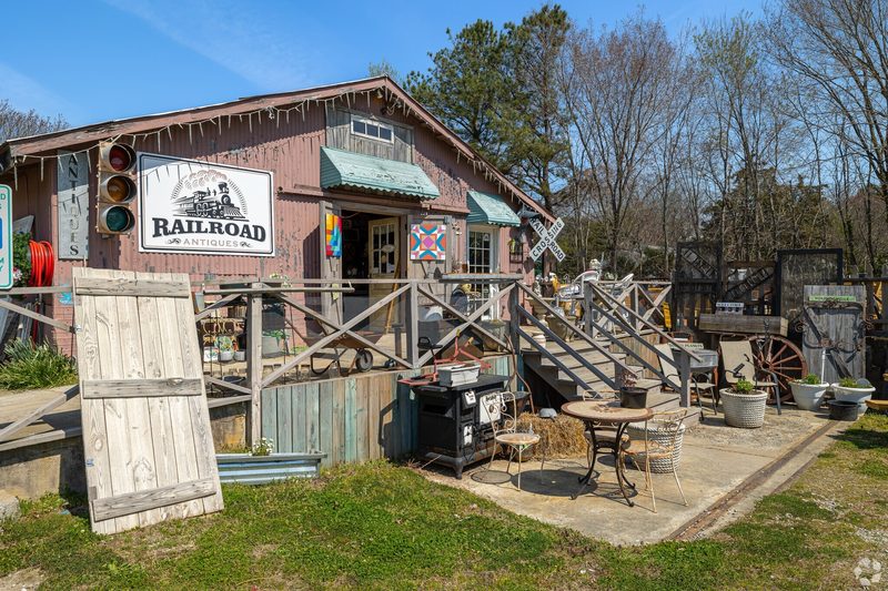 Railroad Antiques shop exterior with vintage items and decor in Youngsville, North Carolina.