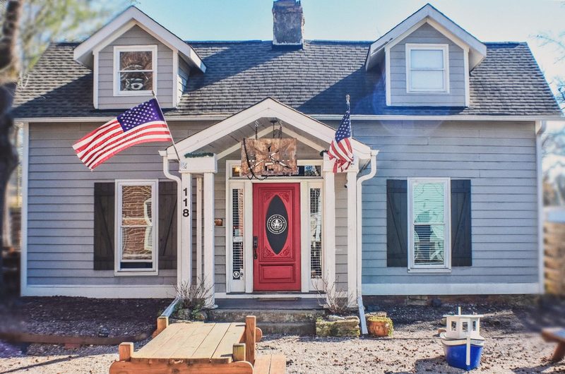 Yacht Beverage House building with American flags and front entrance in Youngsville, North Carolina.