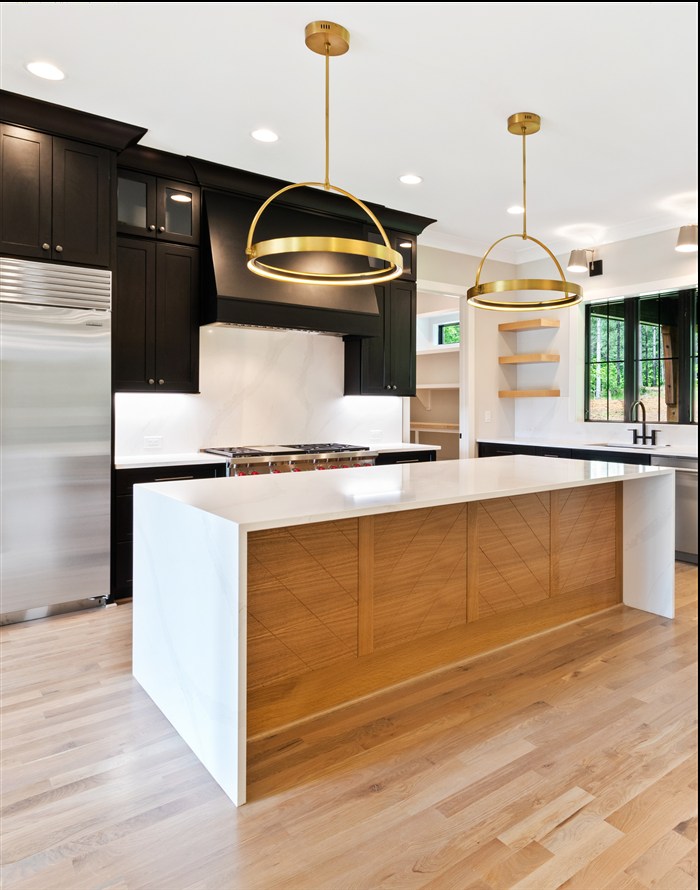 Kitchen with dark cabinetry